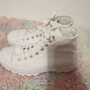 White high Platform Converse sneakers are 2 inches. Tall . Size 8.5 Women.